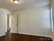 Bright bedroom with durable flooring, neutral paint, and entry to an attached bath at 5905 Waverly Lynn Ln, Charlotte, NC 28269
