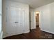 This bedroom offers a closet with folding doors, fresh paint, and durable flooring at 5905 Waverly Lynn Ln, Charlotte, NC 28269
