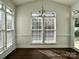 Light-filled dining area featuring large windows and hardwood floors, perfect for entertaining at 5905 Waverly Lynn Ln, Charlotte, NC 28269