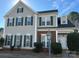 Charming two-story home with gray siding, dark shutters, and a well-manicured lawn in a desirable neighborhood at 5905 Waverly Lynn Ln, Charlotte, NC 28269