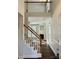 Bright foyer showcasing hardwood floors, staircase, and an inviting view into the spacious living area at 5905 Waverly Lynn Ln, Charlotte, NC 28269