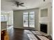 Bright living room with a fireplace, large windows, and hardwood floors, creating a warm and inviting space at 5905 Waverly Lynn Ln, Charlotte, NC 28269