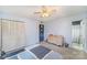 Cozy bedroom featuring neutral walls, a ceiling fan, and a closet, perfect for relaxation at 6817 Fieldlark Ln, Charlotte, NC 28227