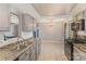 Bright kitchen with stainless steel sink, granite counters, electric range, and easy access to the dining area at 6817 Fieldlark Ln, Charlotte, NC 28227