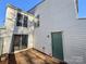 Exterior view of the home showcasing the sliding doors and a fenced backyard area at 7140 Stonington Ln, Charlotte, NC 28227