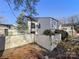 Charming two-story home with light siding, complemented by a well-maintained yard and walkway at 7140 Stonington Ln, Charlotte, NC 28227
