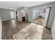 Inviting living room featuring sleek hardwood floors and natural light through sliding glass doors to the yard at 7140 Stonington Ln, Charlotte, NC 28227