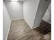 This room has neutral walls, wood floors and is ready for a new owner at 7140 Stonington Ln, Charlotte, NC 28227