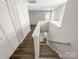Open staircase to upper-level hallway with closets and landing at 7140 Stonington Ln, Charlotte, NC 28227