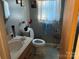 Clean bathroom with vanity sink and toilet at 7426 Riding Trail Rd, Charlotte, NC 28212