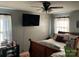 Cozy bedroom with hardwood floors, neutral walls, and lots of space at 7426 Riding Trail Rd, Charlotte, NC 28212