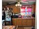 Bright kitchen with wooden cabinets and stainless steel sink at 7426 Riding Trail Rd, Charlotte, NC 28212