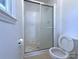 Modest bathroom featuring a tiled shower with sliding glass doors at 7515 Riding Trail Rd, Charlotte, NC 28212