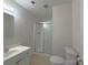 Cozy bathroom featuring a vanity, toilet, and a glass-enclosed shower at 7515 Riding Trail Rd, Charlotte, NC 28212