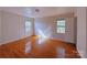 Bedroom with hardwood floors, natural light, and ample space at 7515 Riding Trail Rd, Charlotte, NC 28212
