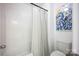 Clean bathroom with shower, toilet, and neutral colors at 7672 Tanglewood Way, Denver, NC 28037