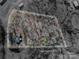 The property is surrounded by mature trees and has outlined lot lines to provide a clear understanding of the property boundaries at 8080 Monbo Rd, Catawba, NC 28609