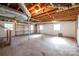 Unfinished basement area providing ample space and natural light from windows for flexible use at 8080 Monbo Rd, Catawba, NC 28609