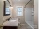 Full bathroom features granite countertop, vanity, toilet and shower/tub combo at 8080 Monbo Rd, Catawba, NC 28609