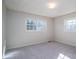Neutral bedroom boasts carpet and double windows for ample natural light at 8080 Monbo Rd, Catawba, NC 28609