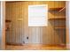 Bedroom featuring wood paneling, a window with natural light, and built-in shelves at 8080 Monbo Rd, Catawba, NC 28609