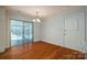 Dining area with hardwood floors, access to sunroom, and a convenient door at 8080 Monbo Rd, Catawba, NC 28609