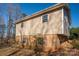 Side view of home with vinyl siding, brick foundation, and neatly trimmed bushes near the home at 8080 Monbo Rd, Catawba, NC 28609