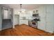 Traditional kitchen features stainless appliances, white cabinets and hardwood floors at 8080 Monbo Rd, Catawba, NC 28609