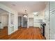 Classic kitchen features hardwood floors, white cabinets and stainless steel range at 8080 Monbo Rd, Catawba, NC 28609