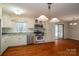 Traditional kitchen showcases stainless appliances, hardwood floors and backyard view at 8080 Monbo Rd, Catawba, NC 28609