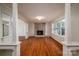 Spacious living room with a brick fireplace, hardwood floors, and large windows at 8080 Monbo Rd, Catawba, NC 28609