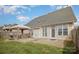 Large backyard featuring a patio with outdoor seating, a grill, and well-maintained lawn at 8603 Ridgeline Ln, Charlotte, NC 28269