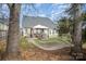 Large backyard featuring a patio with outdoor seating, a grill, and a hammock at 8603 Ridgeline Ln, Charlotte, NC 28269