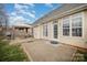 Spacious backyard featuring a patio with covered seating, a grill, and green grass at 8603 Ridgeline Ln, Charlotte, NC 28269