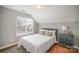 Comfortable bedroom with hardwood flooring, a high ceiling, and a modern paint scheme at 8603 Ridgeline Ln, Charlotte, NC 28269