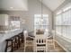 Bright dining area with views into the kitchen and oversized windows at 8603 Ridgeline Ln, Charlotte, NC 28269