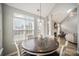 Dining area with large windows, stylish lighting, and open floor plan at 8603 Ridgeline Ln, Charlotte, NC 28269