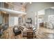Open-concept living space with hardwood floors and a view of the upstairs landing at 8603 Ridgeline Ln, Charlotte, NC 28269