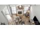Bright living room featuring a fireplace, ceiling fan, neutral color scheme, and hardwood flooring at 8603 Ridgeline Ln, Charlotte, NC 28269
