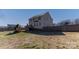 Large fenced backyard with deck, playground, and lush lawn at 8822 Crape Myrtle Dr, Stanfield, NC 28163