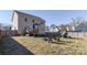 Backyard with wood fence, deck, chairs and playground set at 8822 Crape Myrtle Dr, Stanfield, NC 28163