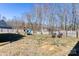 Spacious fenced backyard featuring a playset and outdoor seating area at 8822 Crape Myrtle Dr, Stanfield, NC 28163