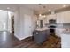 Modern kitchen with stainless steel appliances, granite countertops, and an island at 8822 Crape Myrtle Dr, Stanfield, NC 28163
