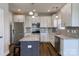 Stylish kitchen with stainless steel appliances, granite countertops, a grey tile backsplash and island seating at 8822 Crape Myrtle Dr, Stanfield, NC 28163