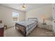 Bedroom with neutral carpet, ceiling fan, and natural light from the window at 8830 Cinnabay Dr, Charlotte, NC 28216