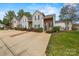 Charming townhome featuring neutral siding, brick accents, and a well-maintained lawn at 8830 Cinnabay Dr, Charlotte, NC 28216