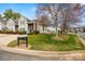 Exterior view of a well-maintained townhouse community with mature trees and green lawns at 8830 Cinnabay Dr, Charlotte, NC 28216