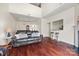 Bright living room featuring a plush sofa, hardwood floors, and an open floor plan at 8830 Cinnabay Dr, Charlotte, NC 28216