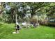 Inviting backyard with outdoor seating, a fire pit, and string lights for cozy gatherings at 908 Dogwood Dr, Gastonia, NC 28054