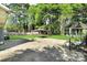 Spacious backyard featuring a large concrete patio and an outdoor gazebo at 908 Dogwood Dr, Gastonia, NC 28054